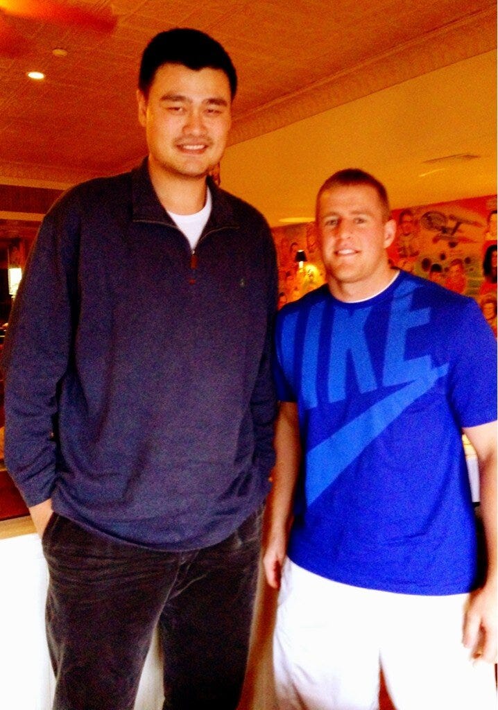 jj-watt-who-is-6-foot-5-and-weighs-290-pounds-looks-like-a-high-school-football-player-next-to-ming.jpg