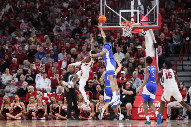 Kentucky center Ugonna Onyenso blocked a shot by Arkansas guard El Ellis during Saturday's game at Bud Walton Arena in Fayetteville.