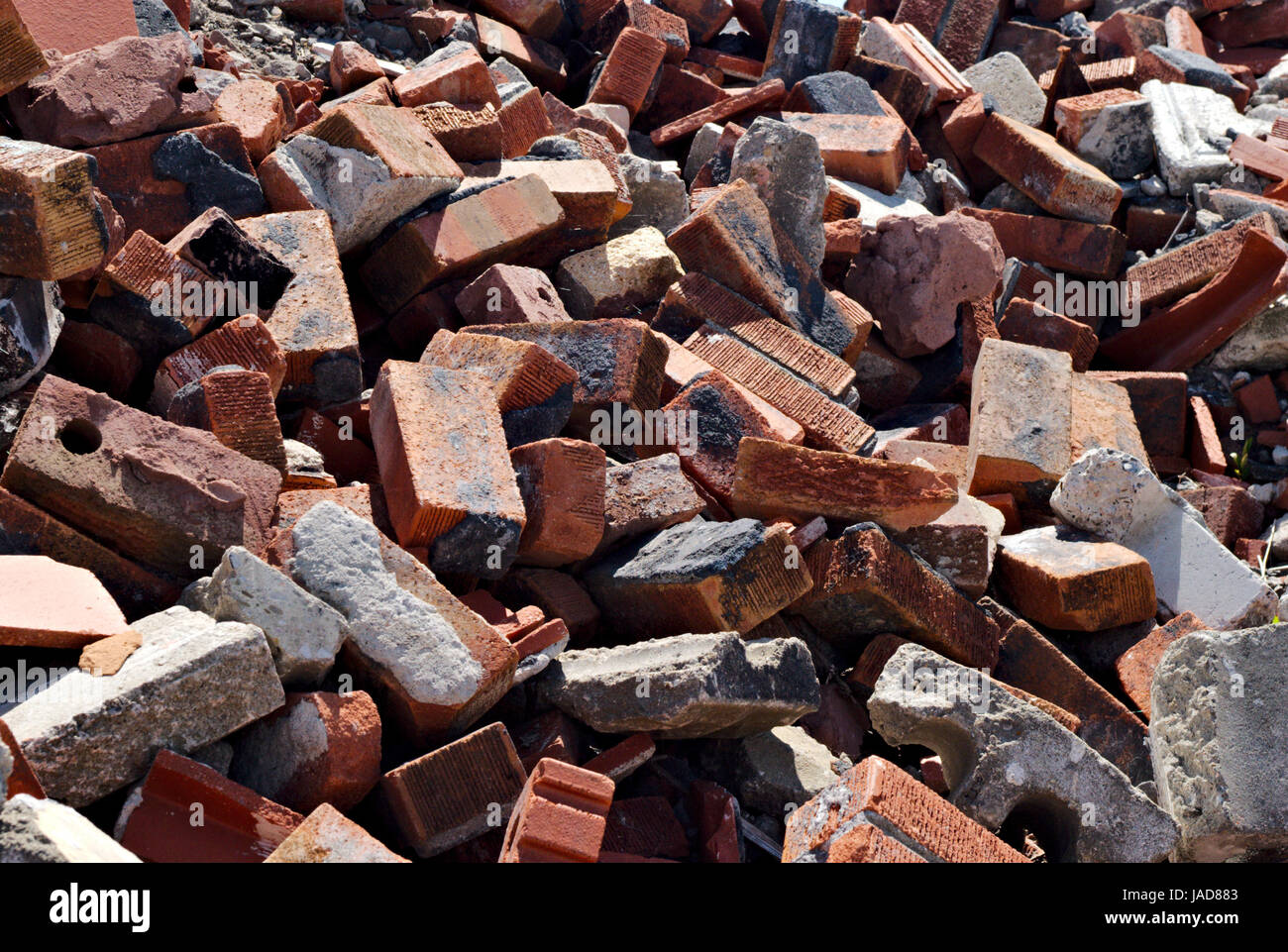 messy-pile-of-jagged-red-bricks-and-debris-background-JAD883.jpg