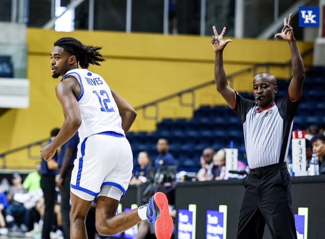 Antonio Reeves ran to the defensive end of the floor after hitting one of his eight 3-pointers in Saturday's 104-92 win by the Wildcats.