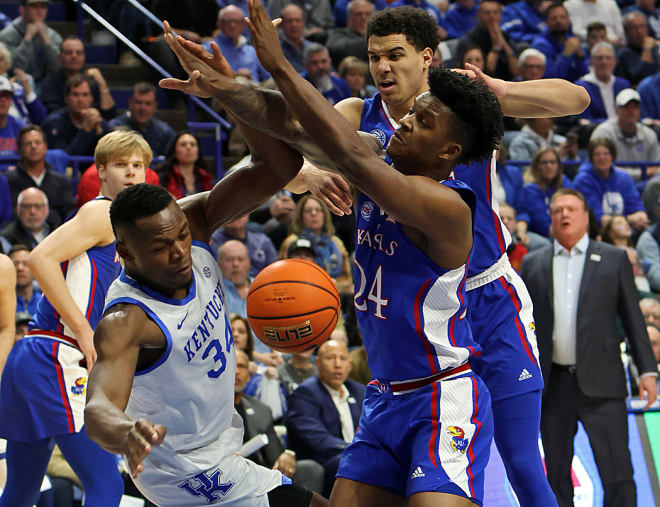 Kentucky's Oscar Tshiebwe lost control of the ball after facing a double-team by the Jayhawks in the first half of Saturday's game at Rupp Arena.