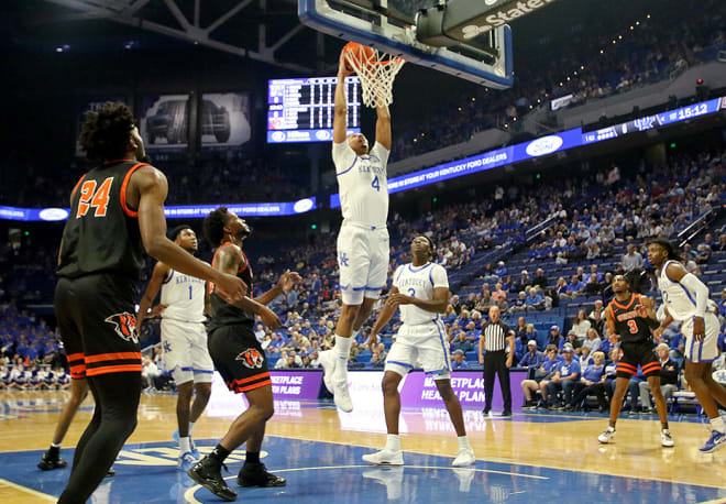 Kentucky's Tre Mitchell slammed in two of his game-high 22 points in the Wildcats' 92-69 exhibition win over Georgetown College on Friday night at Rupp Arena.