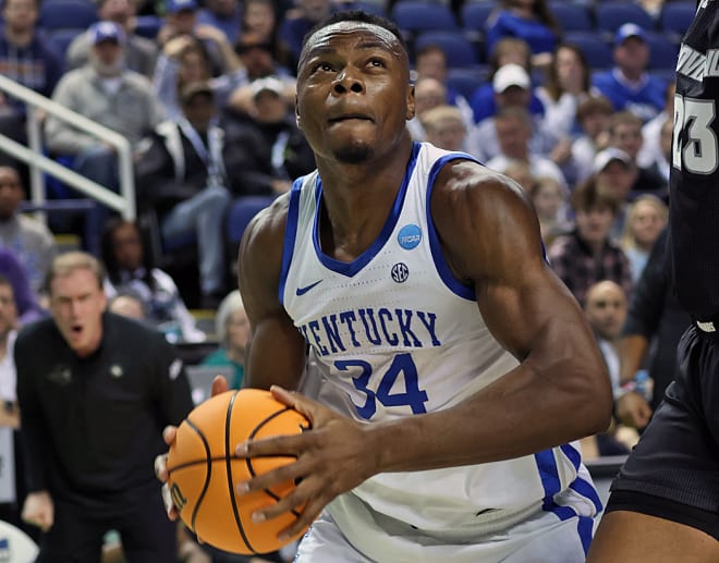 Kentucky's Oscar Tshiebwe eyed the rim after grabbing one of his UK postseason record 25 rebounds against Providence.