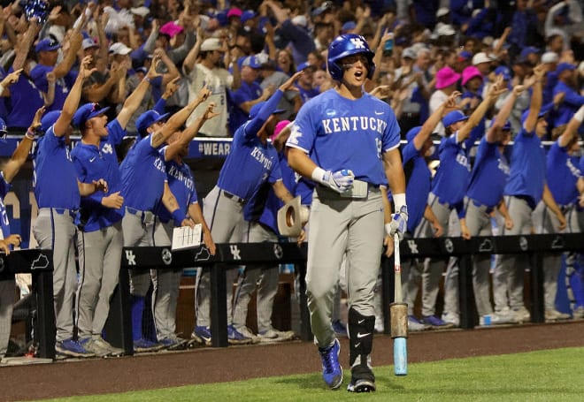 Kentucky's Grant Smith pumped his fist as the Wildcats' dugout celebrated their team taking the lead over Oregon State on Sunday night in the NCAA Lexington Super Regional championship game.