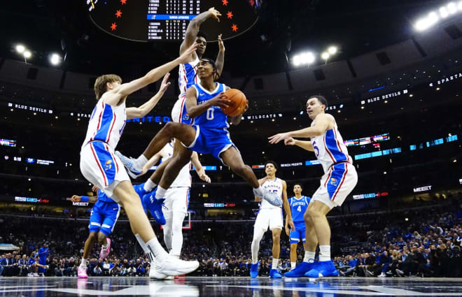 Kentucky freshman guard Rob Dillingham hung in the air for a shot against Kansas on Tuesday in the Champions Classic at the United Center in Chicago.