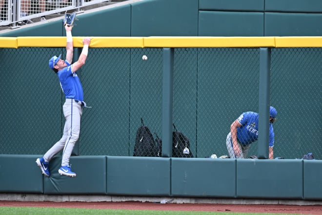 Kentucky right fielder James McCoy leaped in vain as a ball off the bat of Florida's Brody Donay cleared the fence for a grand slam in the Gators' seven-run first inning.
