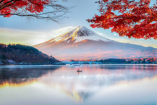 fuji-mountain-red-maple-tree-and-fisherman-boat-with-morning-mist-in-autumn-kawaguchiko-lake.jpg