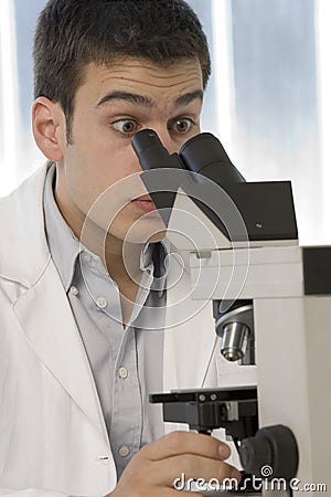 young-scientist-watching-inside-microscope-6436214.jpg