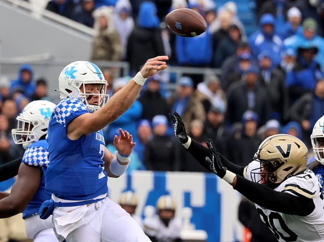 Kentucky's Will Levis threw under pressure from Vanderbilt defensive end Nate Clifton during Saturday's game at Kroger Field.