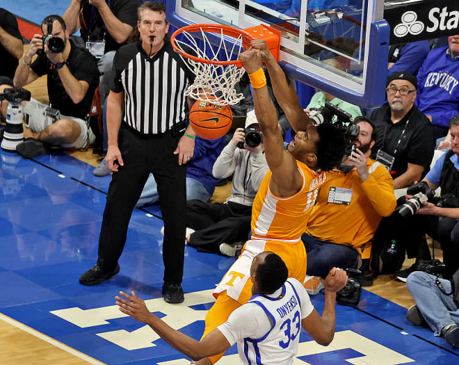 Tennessee's Tobe Awaka dunked over Kentucky center Ugonna Onyenso during the second half of the Volunteers' 103-92 win over the Wildcats on Saturday night at Rupp Arena.