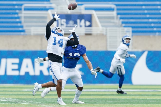 Cornerback Carrington Valentine (14) broke up a pass during spring practice.