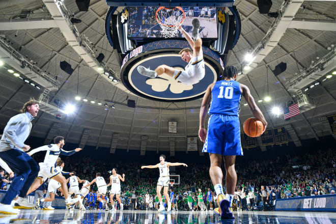 Notre Dame players began the celebration after beating Kentucky 66-62 on Saturday in South Bend.