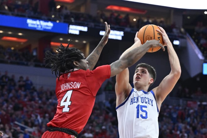 Kentucky's Reed Sheppard elevated for a shot over Louisville's Ty-Laur Johnson during Thursday's game at the KFC Yum! Center.