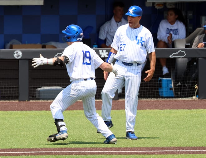 Kentucky head coach Nick Mingione celebrated a home run by outfielder Nolan McCarthy (19) during the NCAA Lexington Regional.