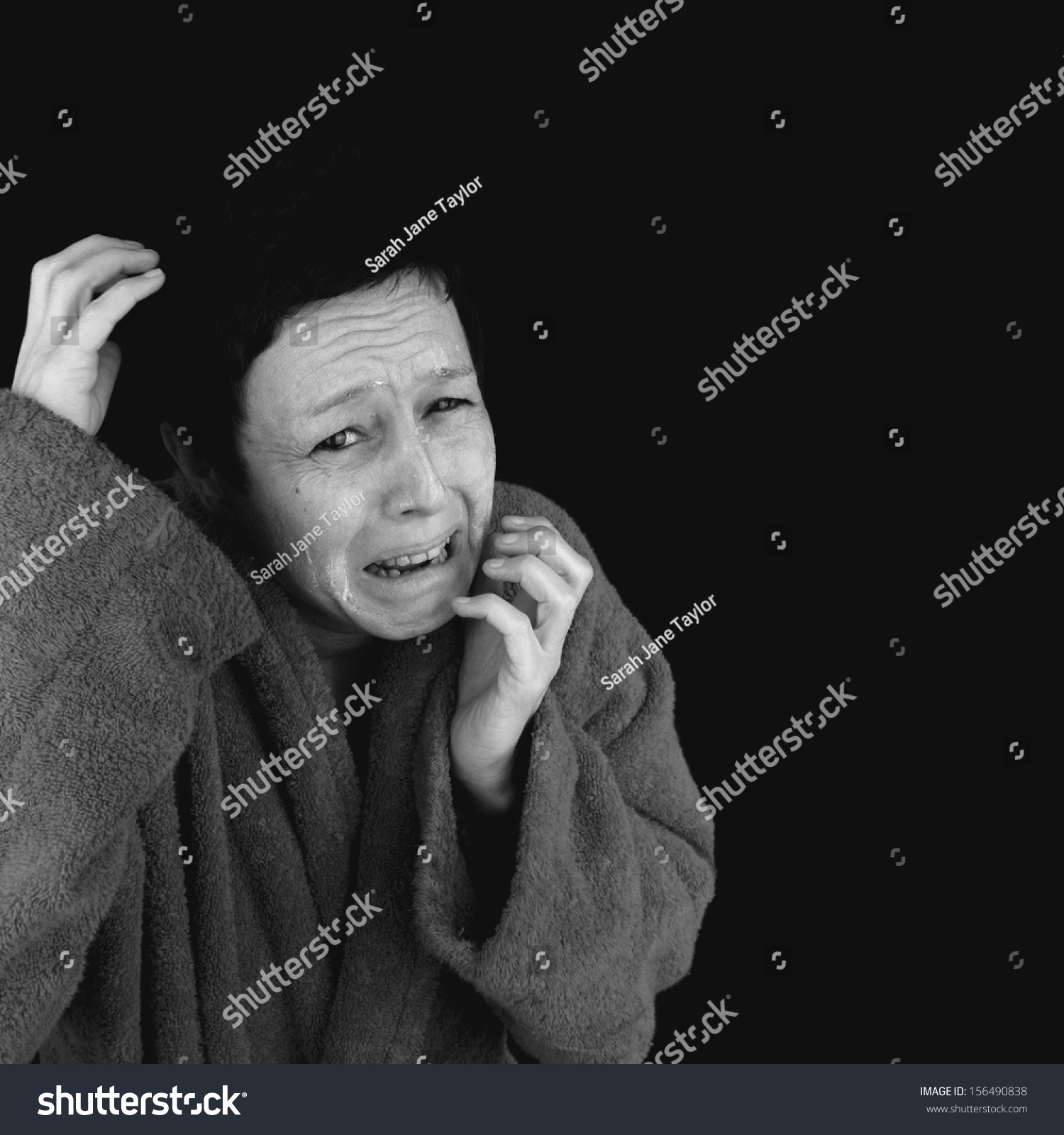 stock-photo-scared-depressed-woman-wearing-bathrobe-cowering-in-fear-black-and-white-image-156490838.jpg