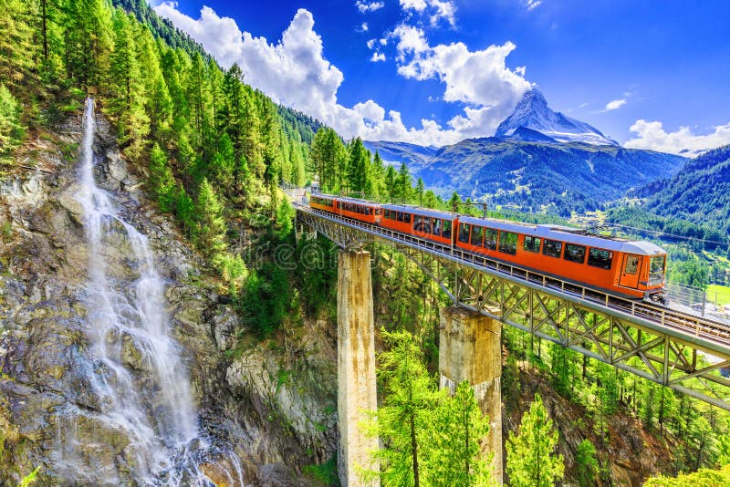 zermatt-switzerland-zermatt-switzerland-gornergrat-tourist-train-waterfall-bridge-matterhorn-valais-region-98823419.jpg