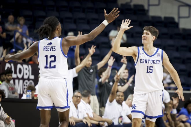 Kentucky's Antonio Reeves and Reed Sheppard exchanged a high-five during the Wildcats' 104-92 win over Africa on Saturday to remain unbeaten at GLOBL Jam in Toronto, Canada. 