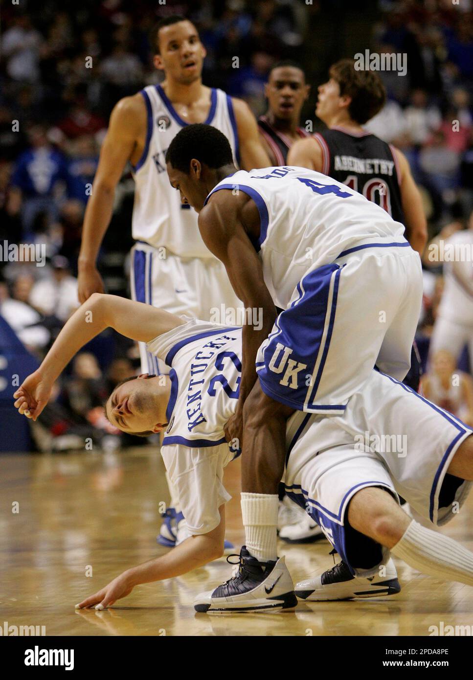 kentuckys-rajon-rondo-right-picks-up-teammate-patrick-sparks-after-sparks-committed-a-foul-during-the-first-half-against-mississippi-at-the-2006-southeastern-conference-basketball-tournament-thursday-march-9-2006-at-the-gaylord-entertainment-center-in-nashville-tenn-ap-photojohn-bazemore-2PDA8PE.jpg