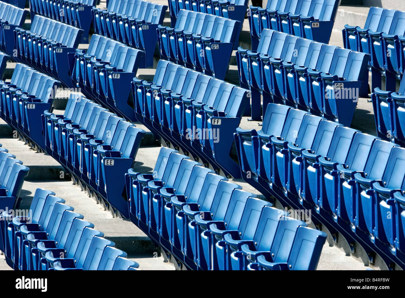 rows-of-empty-blue-seats-at-a-baseball-stadium-B4RFBW.jpg