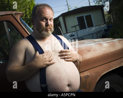 overweight-man-with-suspenders-by-truck-a5pcpn.jpg
