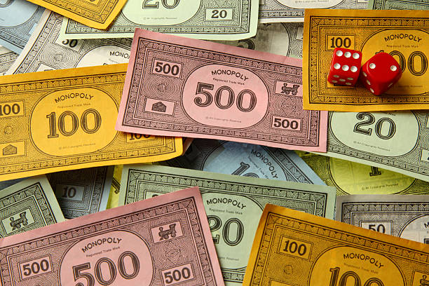 monopoly-game-money-with-dice-picture-id458533693